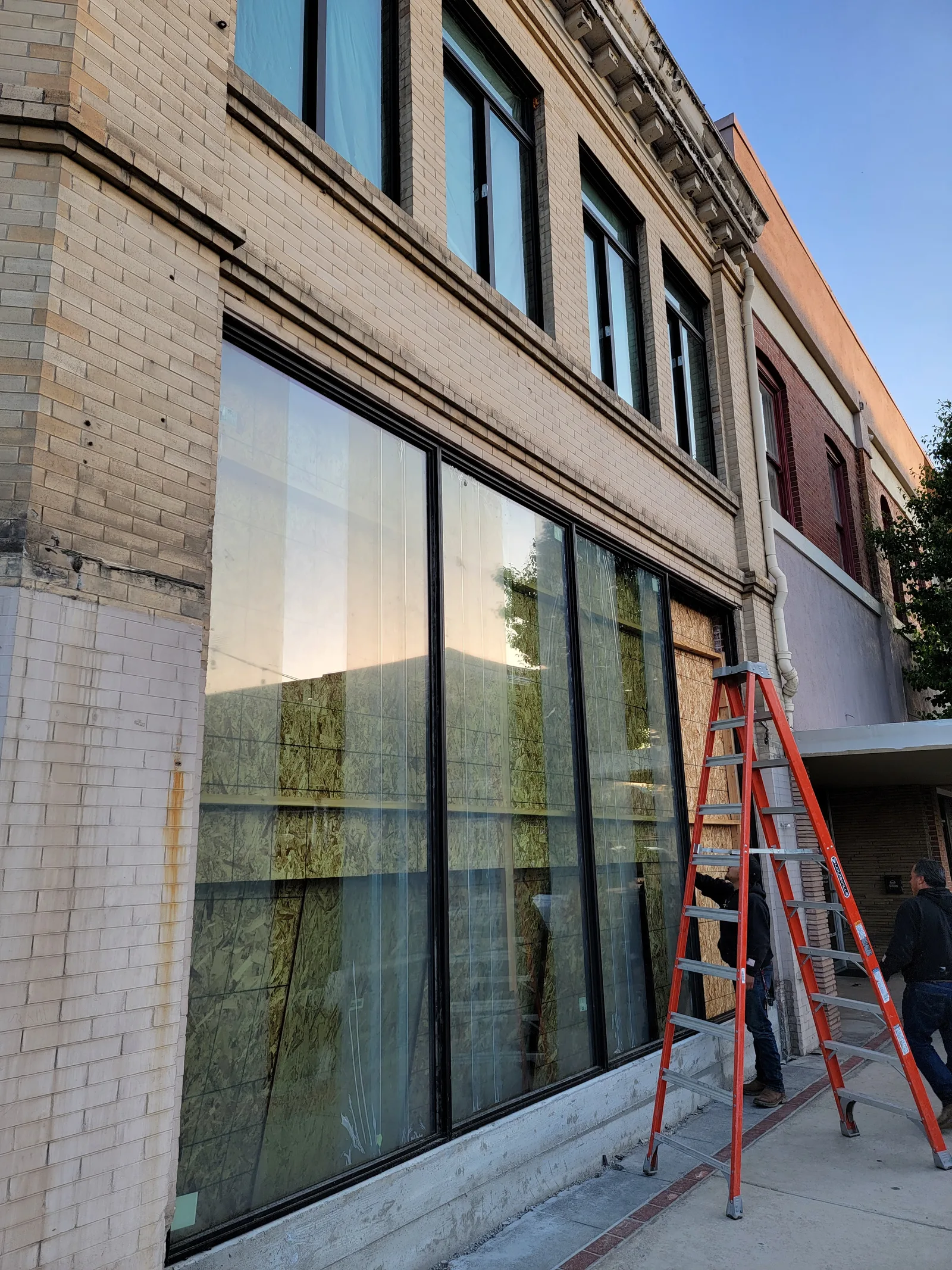 Commercial storefront project with a crew on site