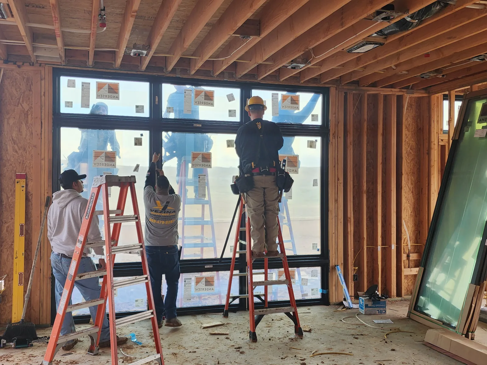 Vezina crew installing a full-height window wall