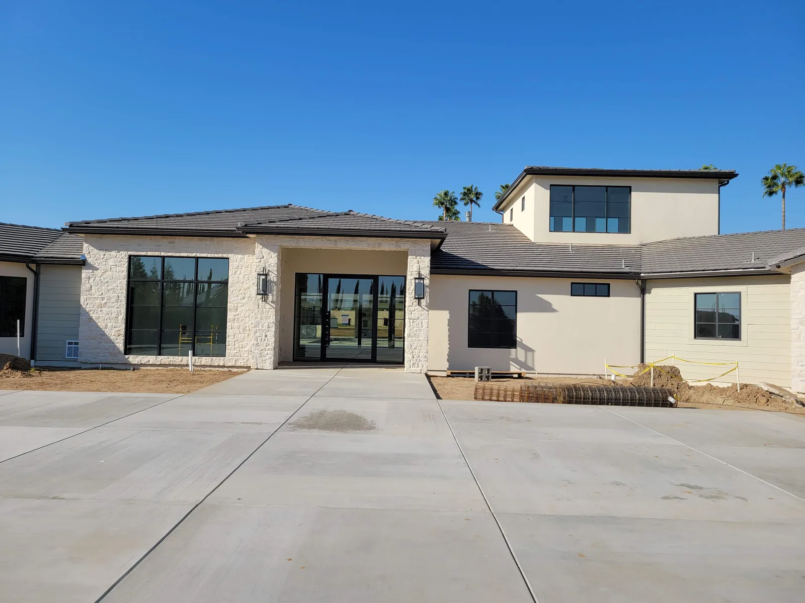 Black-frame Milgard windows on a Central Valley home