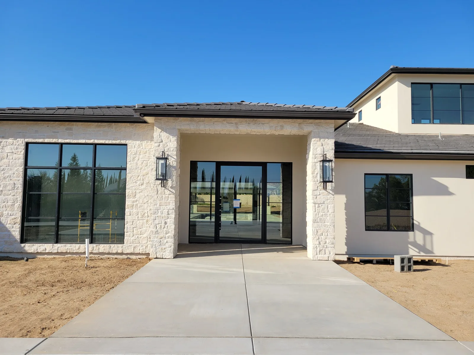 Glass entry with black-frame windows