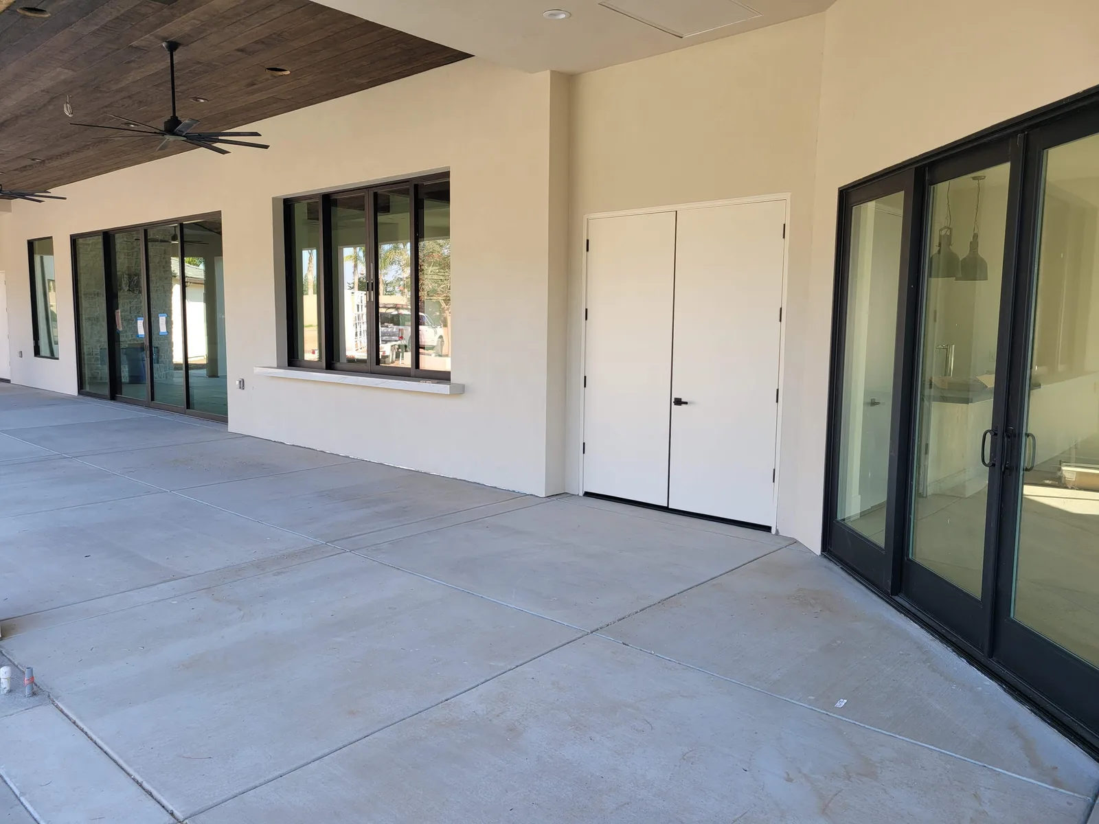 Milgard black-frame patio doors on a Central Valley home